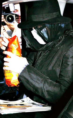 Pop star Michael Jackson is seen wearing a surgical mask and leaving a medical building in Beverly Hills on Wednesday. 