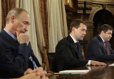 Russia's Prime Minister Vladimir Putin (L-R), President Dmitry Medvedev and Energy Minister Sergei Shmatko meet European prime ministers in Barvikha outside Moscow January 14, 2009. European Union nations and firms may sue Russia and Ukraine unless the two countries quickly restore gas supplies to the bloc, the European Commission's president said on Wednesday. Russia met prime ministers Robert Fico of Slovakia, Zinaida Greceanii of Moldova and Sergei Stanishev of Bulgaria.