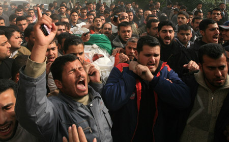 Palestinian Hamas members carry the body of Hamas Interior Minister Said Siam during his funeral in Gaza City, Jan. 16, 2009. 