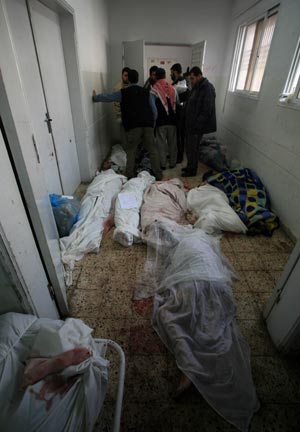 Bodies of Palestinian people killed by Israeli military operations in Gaza Strip lie at a mortuary in Gaza City, Jan. 16, 2009. The death toll in Gaza has risen to more than 1140 since the beginning of the Israeli massive attack on Gaza on Dec. 27, 2008, with about 5150 wounded, Gaza emergency chief Mo'aweya Hassanein said on Friday. (Xinhua/Wissam Nassar)