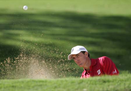 Charles Howell III of the U.S. hits out of the bunker on the fifth hole at the Sony Open golf tournament in Honolulu, Hawaii January 15, 2009.