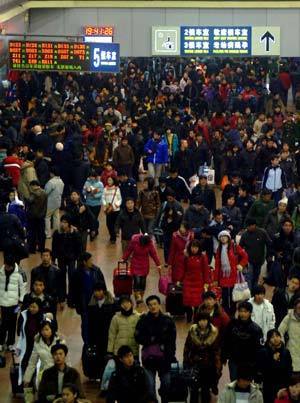 People enter the Beijing West Railway Station in Beijing, capital of China, Jan. 17, 2009. Tens of millions of Chinese are traveling to their home towns or vacation spots for the Lunar New Year, or the Spring Festival, which falls on Jan. 26 this year.