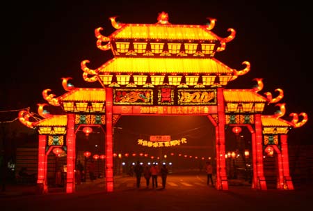 People look at color lanterns during a lantern fair in Meishan, southwest China's Sichuan Province. The 30-day lantern fair, showing the achievements under China's reform and opening policies, was opened in Meishan on Friday. 