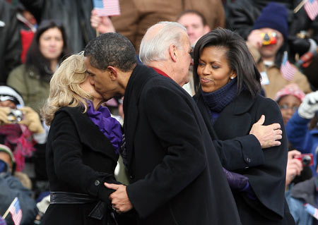 U.S. Vice President-elect Joe Biden (R2) greets Michelle Obama (R1), wife of U.S. President-elect Barack Obama, at the welcoming ceremony in Wilmington, the United States, Jan. 17, 2009. 