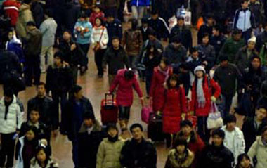 People enter the Beijing West Railway Station in Beijing, capital of China, Jan. 17, 2009. Tens of millions of Chinese are traveling to their home towns or vacation spots for the Lunar New Year, or the Spring Festival, which falls on Jan. 26 this year.