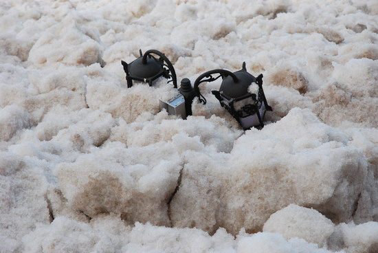 A street lamp submerged by the ice surge.