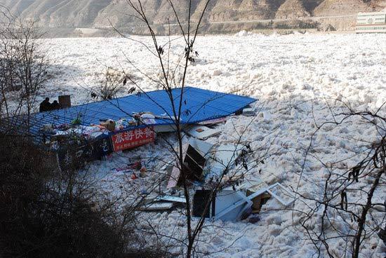 Houses covered by the ice surge.