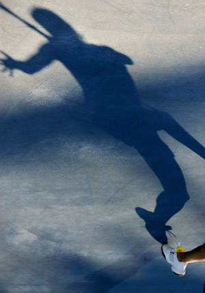 The shadow of Russian Dinara Safina is seen on the ground during the first round of the women's singles between Safina and her compatriot Alla Kudryavtseva at the 2009 Australian Open held in Melbourne, Australia, Jan. 19, 2009. [Xinhua]