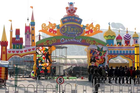 Workers speed up the construction of the carnival theme park seated northeast to the National Stadium known as the 'bird's nest' in Beijing, capital of China, Jan. 19, 2009. The park is planned to open during the Spring Festival holiday, which begins on Jan. 26 this year