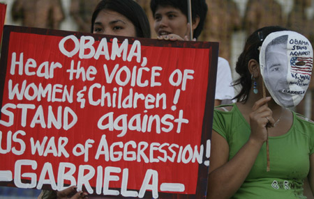 Filipino women and children gather in a park in Quezon City, north of Manila, Jan. 19, 2009 to express their demand for justice to the Palestinian women and children who comprise a big number of those killed and injured by Israeli attacks on Gaza. 