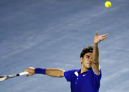 Switzerland's Roger Federer serves to Italy's Andreas Seppi during the first round of the men's singles at the 2009 Australian Open held in Melbourne, Australia, Jan. 19, 2009. Federer won 3-0 and advanced to the next round. 