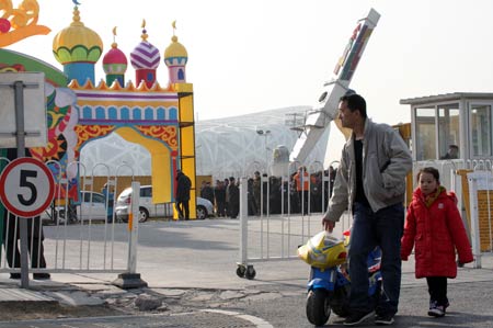 A carnival theme park seated northeast to the National Stadium known as the 'bird's nest' is under construction in Beijing, capital of China, Jan. 19, 2009. The park is planned to open during the Spring Festival holiday, which begins on Jan. 26 this year.