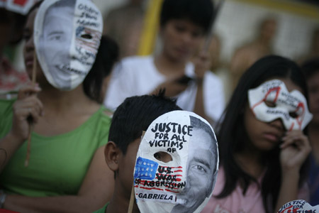 Filipino women and children gather in a park in Quezon City, north of Manila, Jan. 19, 2009 to express their demand for justice to the Palestinian women and children who comprise a big number of those killed and injured by Israeli attacks on Gaza.