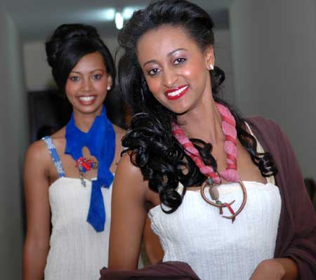Two girls pose for a photo at the tiring-room during the finals of the Miss Ethiopia 2009 Beauty Pageant in Addis Ababa, capital of Ethiopia, Jan. 18, 2009.
