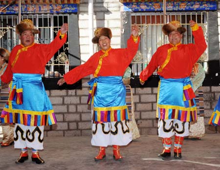 People of the Tibetan ethnic group dance to celebrate the setting of the Serfs Emancipation Day in Lhasa, capital of southwest China&apos;s Tibet Autonomous Region, Jan. 19, 2009. The People&apos;s Congress (legislature) of Tibet Autonomous Region endorsed a bill on Monday to designate March 28 as the Serfs Emancipation Day to mark the date on which about 1 million serfs in the region were freed 50 years ago. On March 28, 1959, China&apos;s central government announced it would dissolve the aristocratic local government of Tibet and replace it with a preparatory committee for establishing Tibet Autonomous Region. (Xinhua/Chogo)