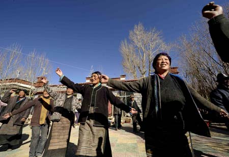 Villagers of the Tibetan ethnic group dance to celebrate the setting of the Serfs Emancipation Day in Banjorihunbo Village of southwest China&apos;s Tibet Autonomous Region, Jan. 19, 2009. The People&apos;s Congress (legislature) of Tibet Autonomous Region endorsed a bill on Monday to designate March 28 as the Serfs Emancipation Day to mark the date on which about 1 million serfs in the region were freed 50 years ago. On March 28, 1959, China&apos;s central government announced it would dissolve the aristocratic local government of Tibet and replace it with a preparatory committee for establishing Tibet Autonomous Region. (Xinhua/Purbu Zhaxi)