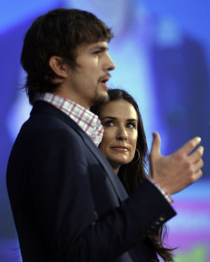 Actors Ashton Kutcher (L) and Demi Moore introduce their Presidential Pledge video at ServiceNation's New Era of Service breakfast, part of the Martin Luther King Jr. Day of Service, in Washington January 19, 2009 leading up to the inauguration of U.S. President-elect Barack Obama. 