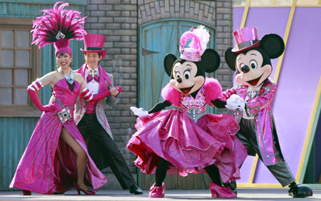 Mickey, Minnie and Pluto dressed in new designed clothes perform during a dance show for celebrating the New Year of Ox at the Tokyo Disneyland in Urayasu City of Chiba Prefecture, south of Tokyo, Jan. 19, 2009. 