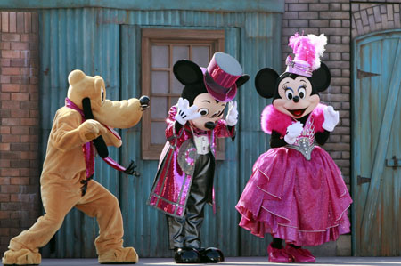 Mickey, Minnie and Pluto dressed in new designed clothes perform during a dance show for celebrating the New Year of Ox at the Tokyo Disneyland in Urayasu City of Chiba Prefecture, south of Tokyo, Jan. 19, 2009. 