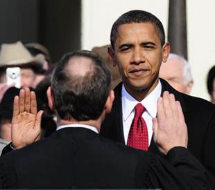 Barack Obama swears in as the 44th president of the United States of America in front of the U.S. Capitol in Washington D.C. Jan. 20, 2009. [Zhang Yan/Xinhua] 