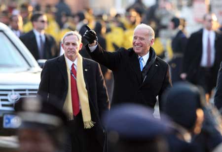 Newly-inaugurated US Vice President Joe Biden gestures to the crowd during the inaugural parade in Washington D.C. Jan. 20, 2009. 