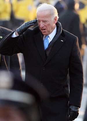 Newly-inaugurated US Vice President Joe Biden salutes the crowd during the inaugural parade in Washington D.C. Jan. 20, 2009. 