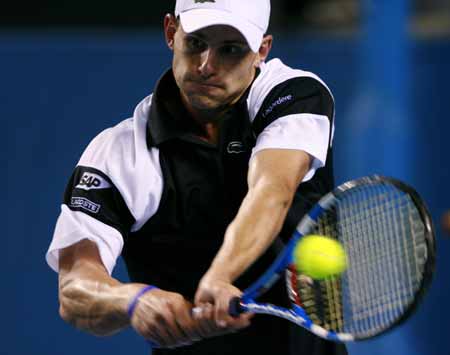 Andy Roddick of the U.S. returns the ball to Xavier Malisse of Belgium during the men's singles second round match at the Australian Open tennis tournament in Melbourne, Australia, Jan. 21, 2009.