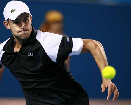 Andy Roddick of the U.S. returns the ball to Xavier Malisse of Belgium during the men's singles second round match at the Australian Open tennis tournament in Melbourne, Australia, Jan. 21, 2009. 