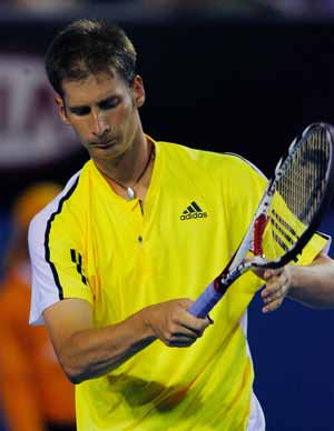 Florian Mayer of Germany reacts after losing one point to Juan Martin Del Potro of Argentina during the men's singles second round match at the Australian Open tennis tournament in Melbourne, Australia, Jan. 21, 2009. Mayer lost 0-3. 