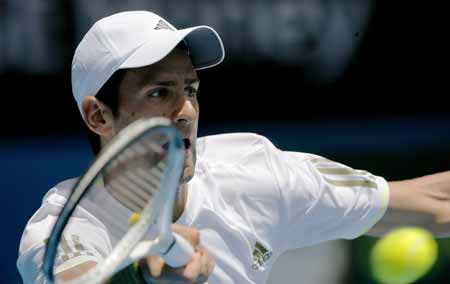 Novak Djokovic of Serbia returns the ball during the second round match of men's singles against Jeremy Chardy of France at the Australian Open tennis tournament in Melbourne, Jan. 21, 2009. Djokovic won 3-0 (7-5, 6-1, 6-3). 