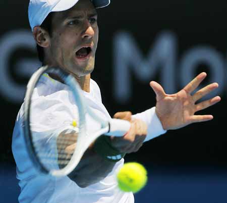 Novak Djokovic of Serbia returns the ball during the second round match of men's singles against Jeremy Chardy of France at the Australian Open tennis tournament in Melbourne, Jan. 21, 2009. Djokovic won 3-0 (7-5, 6-1, 6-3). 