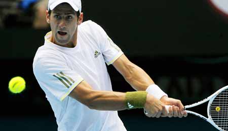 Novak Djokovic of Serbia returns the ball during the second round match of men's singles against Jeremy Chardy of France at the Australian Open tennis tournament in Melbourne, Jan. 21, 2009. Djokovic won 3-0 (7-5, 6-1, 6-3). 