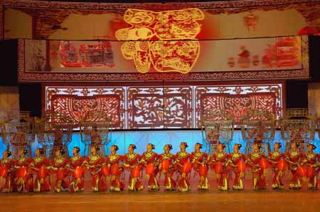 Performers from north China's Shanxi Province dance during a dress rehearsal in China's biggest TV station, CCTV, in Beijing, capital of China, Jan. 3, 2009. China's annual televised Spring Festival (Lunar New Year) Gala, a traditional centerpiece of celebrations to mark the country's most important festival, will be on in the evening of Jan. 25, 2009.