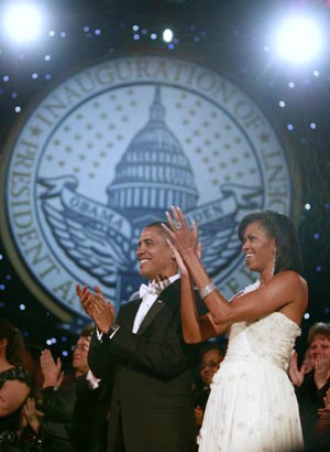 U.S. President Barack Obama and first lady Michelle Obama applaud at the Neighborhood Inaugural Ball in Washington January 20, 2009.