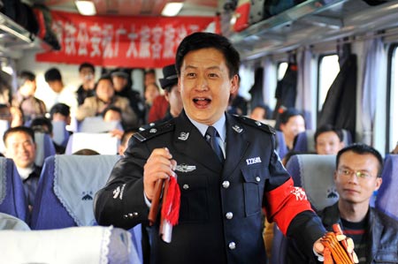 A trainman performs traditional clapper ballad for passengers on the train from Beijing, capital of China, to Yinchuan, capital of northwest China's Ningxia Hui Autonomous Region, Jan. 20, 2009. The 40-day travel peak around the Spring Festival holidays began on Jan. 11, during which some 2.32 billion trips are expected to take place for the Chinese lunar New Year starting from Jan. 26. 