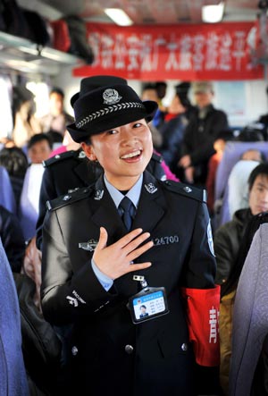 A train steward sings for passengers on the train from Beijing, capital of China, to Yinchuan, capital of northwest China's Ningxia Hui Autonomous Region, Jan. 20, 2009. The 40-day travel peak around the Spring Festival holidays began on Jan. 11, during which some 2.32 billion trips are expected to take place for the Chinese lunar New Year starting from Jan. 26. 