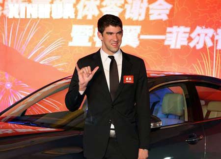 Olympic gold medalist Michael Phelps poses at a press conference in Beijing. Phelps returned to Beijing on Jan. 10 to endorse an automobile maker on the mainland, the latest of several lucrative company sponsorship deals he has signed. 