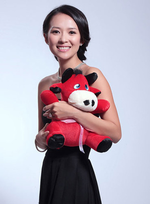 Actress Zhang Ziyi poses with an ox toy and sends her New Year's wishes out to fans. 