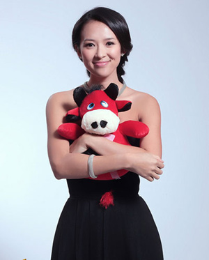 Actress Zhang Ziyi poses with an ox toy and sends her New Year's wishes out to fans. 