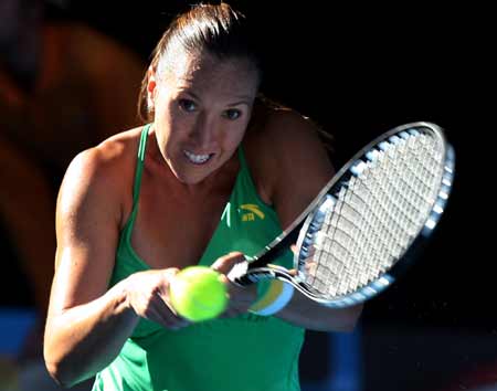 Jelena Jankovic of Serbia returns the ball during the third round match of women's singles against Ai Sugiyama of Japan at the Australian Open tennis tournament in Melbourne, Jan. 23, 2009. Jankovic won 2-0(6-4,6-4).