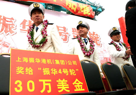 The crew members of the Chinese cargo ship Zhenhua 4 are seen during a commendation ceremony at Changxing Island Port in Shanghai, east China, Jan. 23, 2009. 