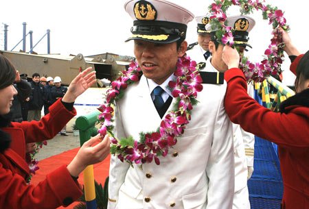 The crew members of the Chinese cargo ship Zhenhua 4 are greeted during a commendation ceremony at Changxing Island Port in Shanghai, east China, Jan. 23, 2009. 