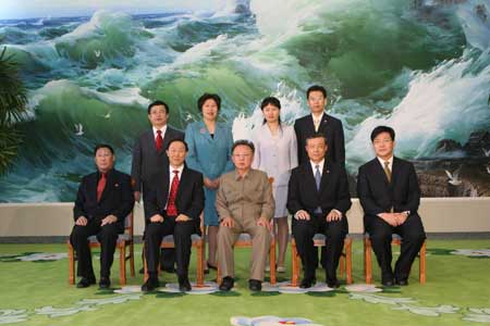 Kim Jong Il (front, C), top leader of the Democratic People's Republic of Korea (DPRK), and Wang Jiarui (front, L2), head of the International Department of the Communist Party of China (CPC) Central Committee, have a group photo taken, in Pyongyang, the Democratic People's Republic of Korea, on Jan. 23, 2009.