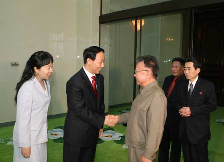 Kim Jong Il (front, R), top leader of the Democratic People's Republic of Korea (DPRK), talks with Wang Jiarui (front, L), head of the International Department of the Communist Party of China (CPC) Central Committee, in Pyongyang, the Democratic People's Republic of Korea, on Jan. 23, 2009.