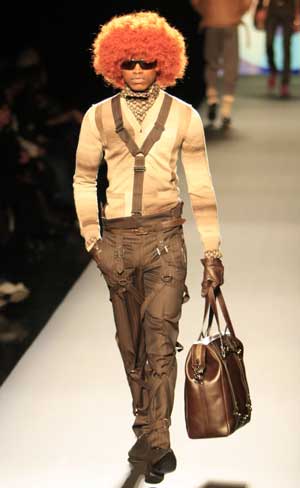 A model displays creations by Jean-Paul Gaultier of his Fall/Winter 2009/2010 men's collections during Paris Fashion Week, on Jan. 22, 2009. 