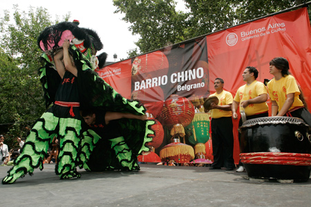 Performers play the lion dance during a temple fair held in the China Street in Buenos Aires, capital of Argentina, Jan. 25, 2009. A Chinese temple fair was held in the China Street on Sunday to celebrate the Chinese Lunar New Year.