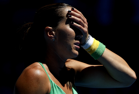 Jelena Jankovic of Serbia reacts during the women's singles fourth round match against Marion Bartoli of France at the Australian Open tennis tournament in Melbourne, Jan. 25, 2009. Bartoli won the match 2-0. 