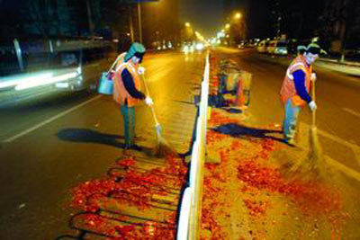About 30,000 sanitation employees in China's finance hub Shanghai worked through the night to sweep up some 1,200 tons of fireworks debris, left behind by revelers on Sunday evening as they welcomed in the Lunar New Year.
