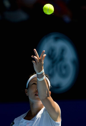 Zheng Jie of China serves during women's singles match against Svetlana Kuznetsova of Russia at the Australian Open tennis tournament in Melbourne, Jan. 26, 2009. Svetlana Kuznetsova of Russia entered the quarter-finals after China's Zheng Jie retired injured from their fourth round match.