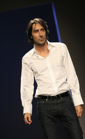 French designer Christophe Josse walks on the stage after the presentation of his Spring-Summer Haute Couture 2009 fashion show in Paris Jan. 26, 2009. (Xinhua/Zhang Yuwei) 